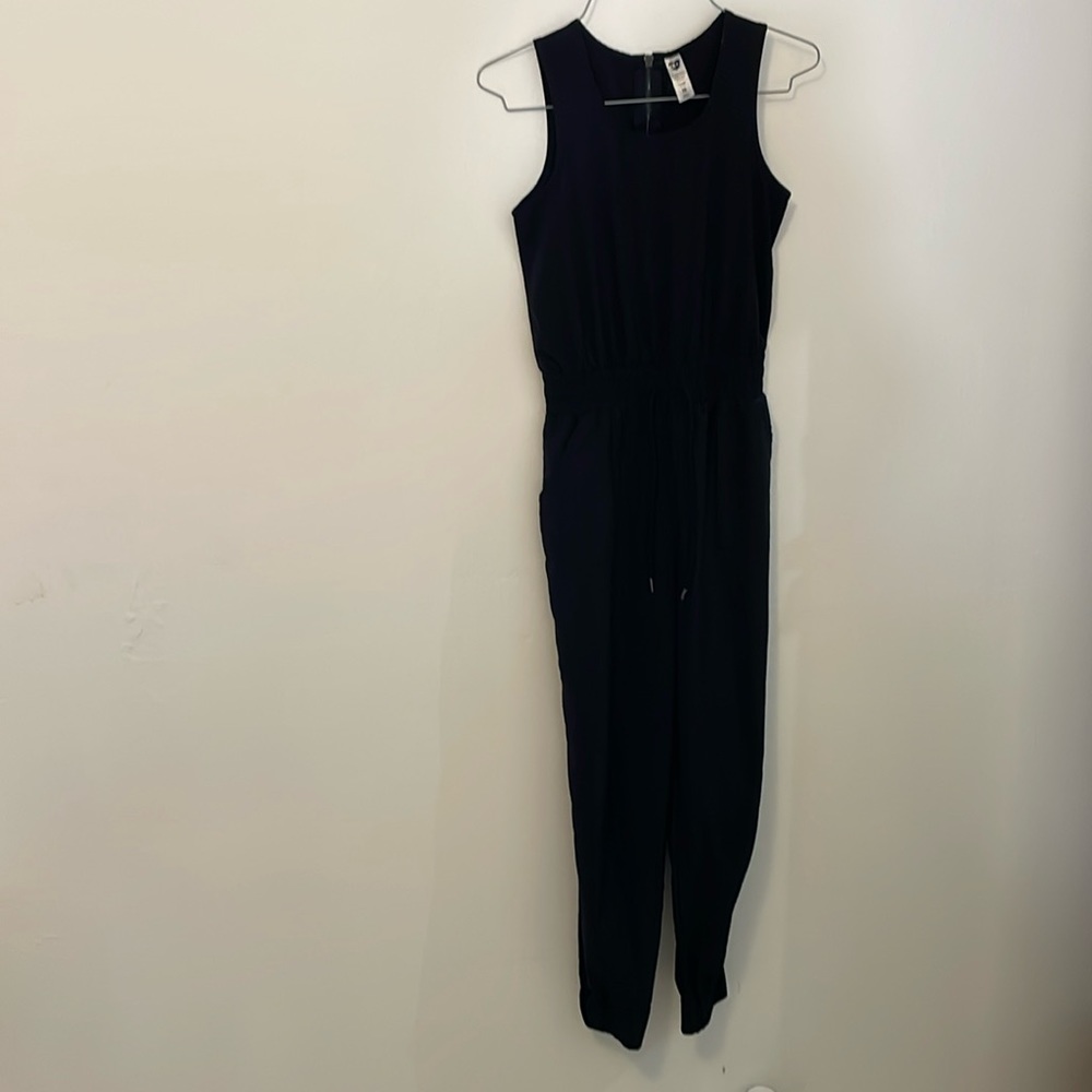 cx•j black jumpsuit size 10, elastic pant leg bottoms, side pockets zipper back
